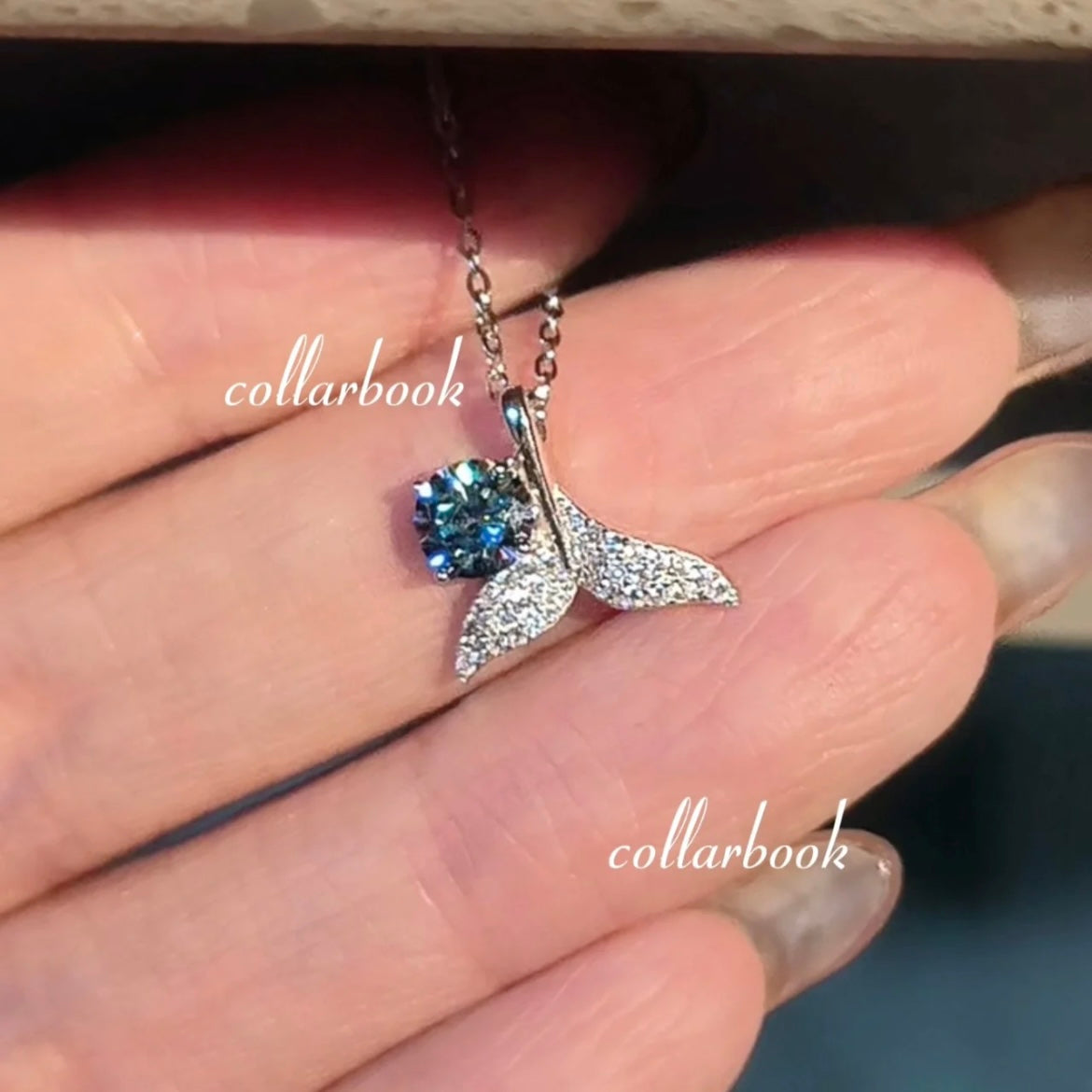 Fishtail Pendant set with Blue Diamonds