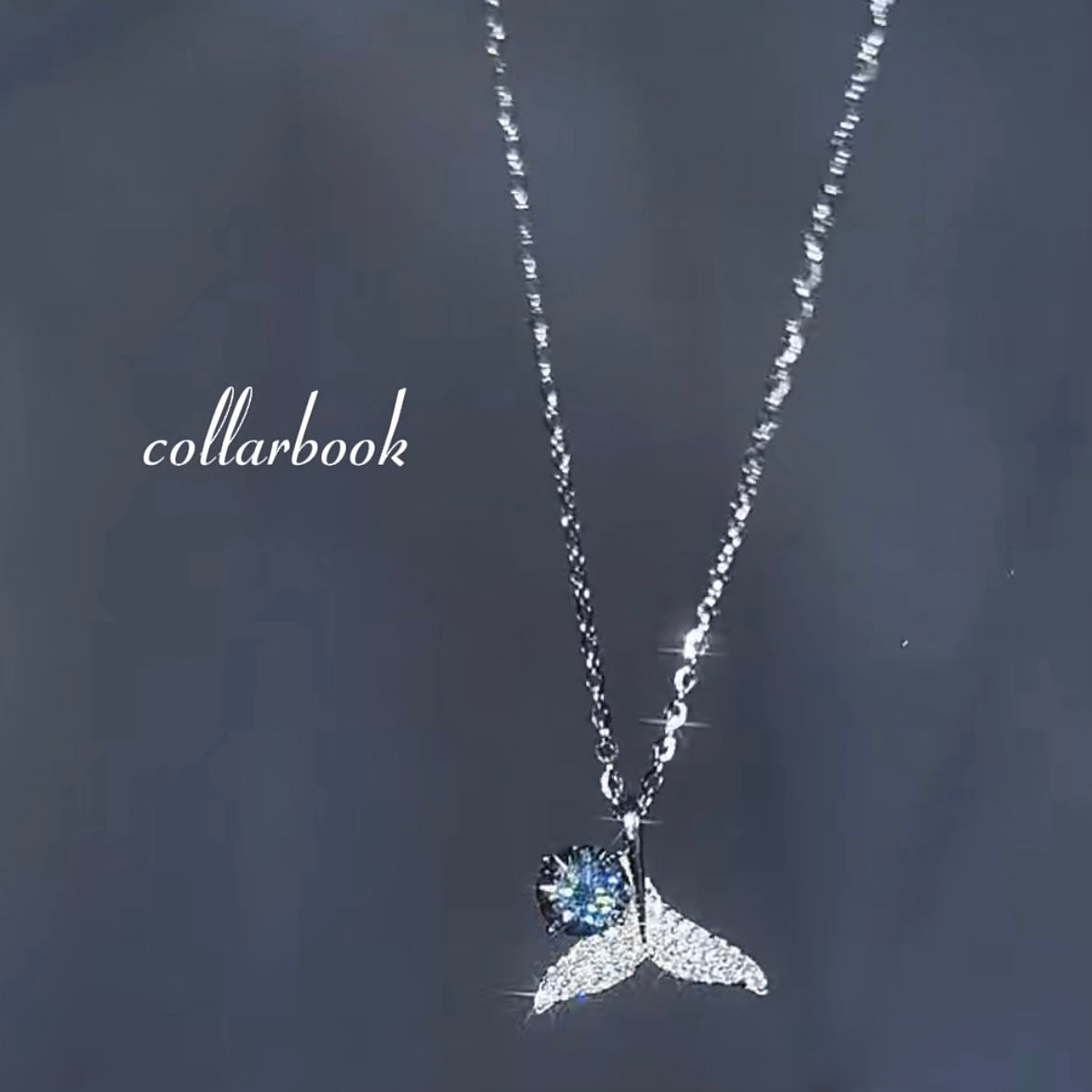 Fishtail Pendant set with Blue Diamonds