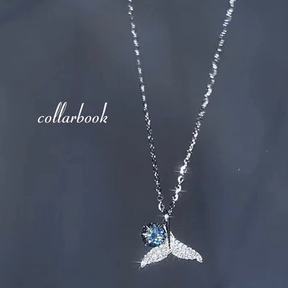 Fishtail Pendant set with Blue Diamonds