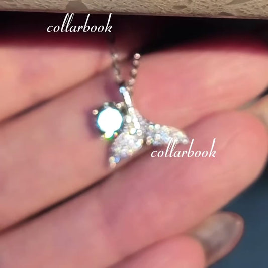 Fishtail Pendant set with Blue Diamonds